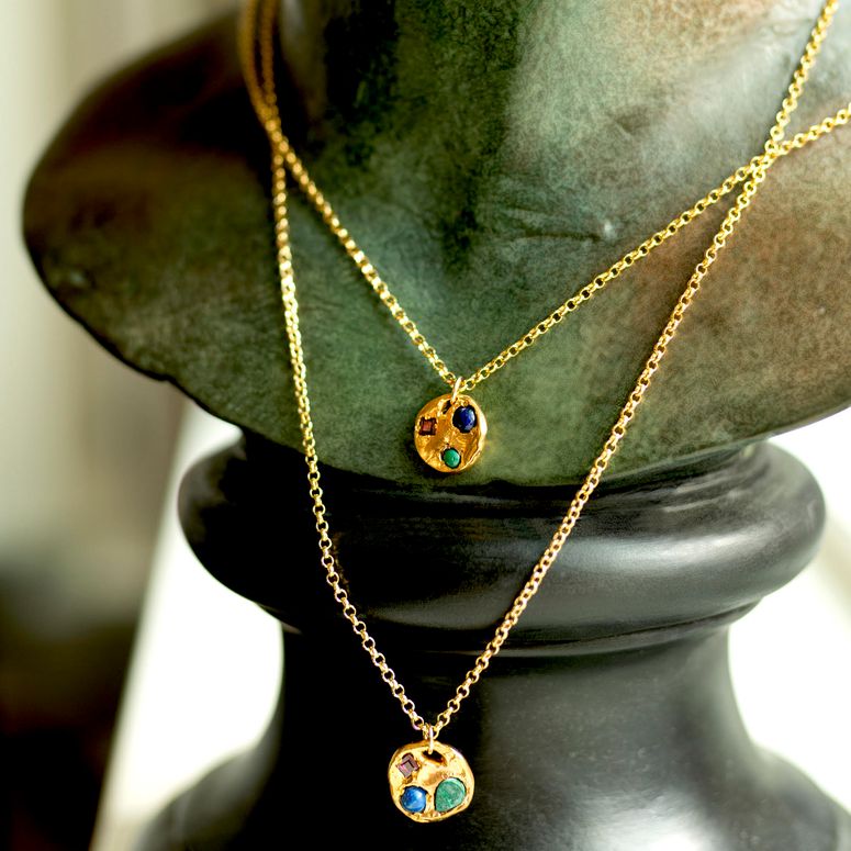 Image may contain: Necklace, Jewelry, Accessories, Accessory, Pendant, Human, and Person